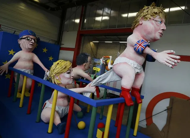 Papier mache caricatures depicting European Commission President Jean-Claude Juncker, French National Front (FN) party leader Marine Le Pen, former Italian Prime Minister Matteo Renzi and Britain's Foreign Secretary Boris Johnson are pictured during preparations for the upcoming Rose Monday carnival parade in Cologne, Germany, February 21, 2017. (Photo by Wolfgang Rattay/Reuters)