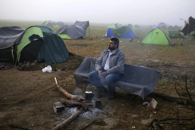 A man sits on the bench at a makeshift camp for migrants and refugees at the Greek-Macedonian border near the village of Idomeni, Greece, April 1, 2016. (Photo by Marko Djurica/Reuters)