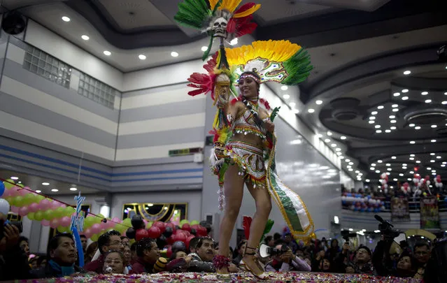 A contestant performs in the contest to elect the Queen of Great Power, in La Paz, Bolivia, Friday, May 24, 2019. (Photo by Juan Karita/AP Photo)