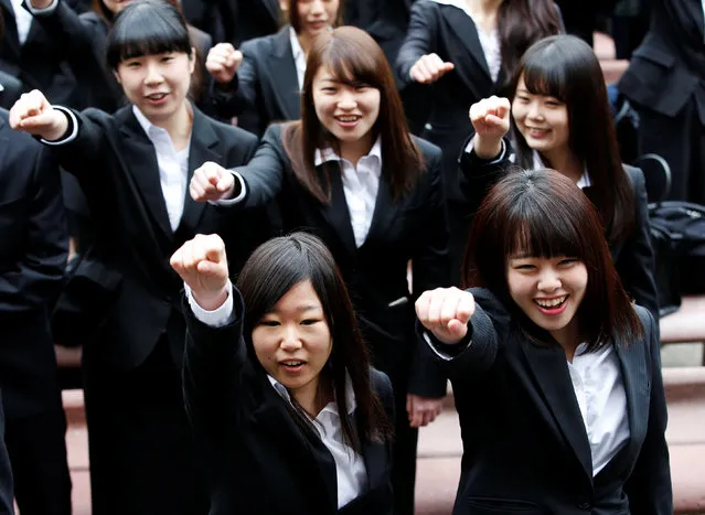 College students shout slogans during a pep rally organized to boost their morale ahead of their job hunting in Tokyo, Japan March 1, 2017. (Photo by Kim Kyung-Hoon/Reuters)