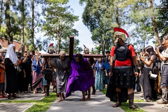 Indonesian Catholics participate in a re-enactment of the crucifixion of Jesus Christ on Good Friday at The Church of the Sacred Heart of Jesus, or Ganjuran Church, on March 29, 2024, in Bantul, Yogyakarta, Indonesia. (Photo by Garry Lotulung/Anadolu via Getty Images)