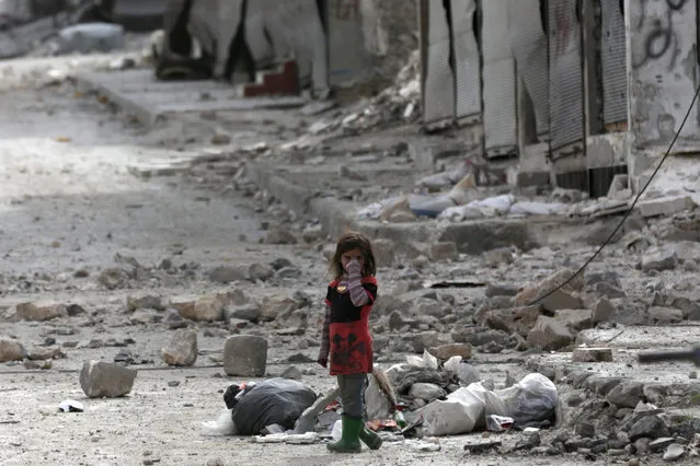 A girl stands amidst the rubble of damaged buildings in the northern Syrian town of al-Bab, Syria, February 28, 2017. (Photo by Khalil Ashawi/Reuters)