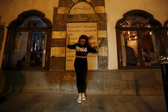 A young woman poses for a photograph outside Beit Zaman hotel where 80s Bar is located in Damascus, Syria March 11, 2016. (Photo by Omar Sanadiki/Reuters)