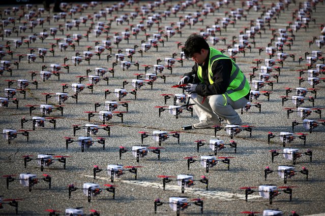 A staff member checks a drone before the World Drone Light Show 2024, which is part of the 2024 Korea Drone Expo, in Incheon, South Korea, on May 9, 2024. (Photo by Kim Hong-Ji/Reuters)