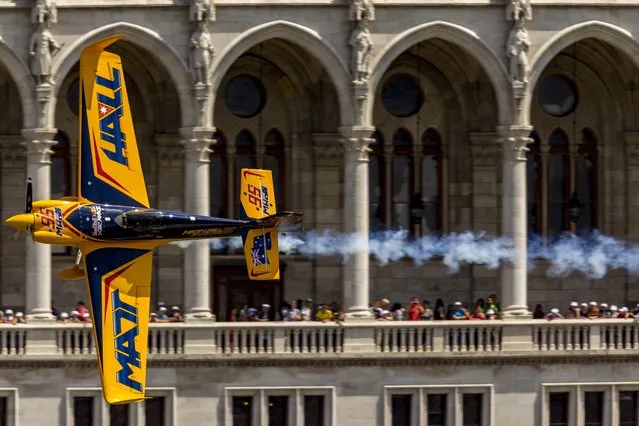 Australian pilot Matt Hall flies above the River Danube during the Masters free practice session of the Red Bull Air Race World Series Budapest stage in central Budapest, Hungary, July 3, 2015. The race is to be held on July 5. (Photo by Zsolt Szigetvary/EPA)