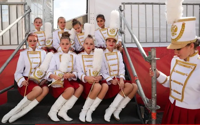 Participants in the Spasskaya Tower Festival of Children's Wind Bands perform at the Children Playground in Red Square as part of the 12th Spasskaya Tower International Military Music Festival in Moscow, Russia on August 23, 2019. (Photo by Mikhail Tereshchenko/TASS)