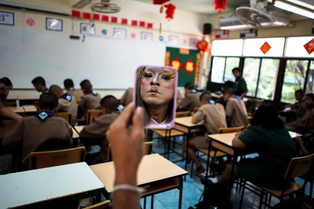 Teeraphong Meesat, 29, known as teacher Bally applies make up before his English class at the Prasartratprachakit School in Ratchaburi Province, Thailand, July 10, 2019. (Photo by Athit Perawongmetha/Reuters)