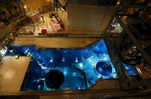A fuel rod is inserted into a reactor vessel (R) inside the No.1 reactor building at Kyushu Electric Power's Sendai nuclear power station in Satsumasendai, Kagoshima prefecture, Japan, July 8, 2015. (Photo by Issei Kato/Reuters)