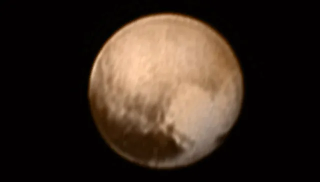 Pluto is pictured in this July 7, 2015 handout image from New Horizons Long Range Reconnaissance Imager (LORRI).This image, the most detailed yet returned by the LORRI aboard New Horizons -- has been combined with lower-resolution color information from the Ralph instrument. (Photo by Reuters/NASA)