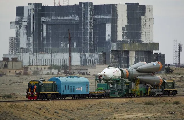 The Soyuz TMA-17M spacecraft is transported from an assembling hangar to its launch pad at the Baikonur cosmodrome, Kazakhstan, July 20, 2015. (Photo by Shamil Zhumatov/Reuters)