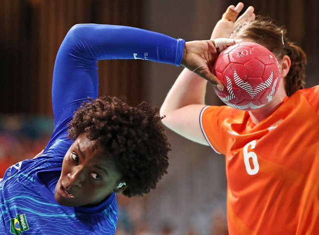 Mariane Fernándes of Brazil in action against Laura van der Heijden of the Netherlands during the pool stage of the women’s handball at the Olympic Games in Paris on August 1, 2024. (Photo by Eloisa Lopez/Reuters)