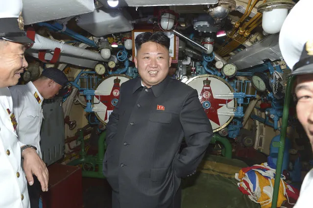 North Korean leader Kim Jong Un (C) visits a submarine during his inspection of the Korean People's Army (KPA) Naval Unit 167 in this undated photo released by North Korea's Korean Central News Agency (KCNA) in Pyongyang June 16, 2014. (Photo by Reuters/KCNA)