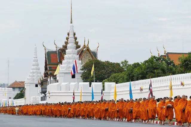 Buddhist monks arrive for a ceremony at the Grand Palace to commemorate Thailand's King Bhumibol Adulyadej's 70th anniversary on the throne, in Bangkok, Thailand June 9, 2016. (Photo by Jorge Silva/Reuters)