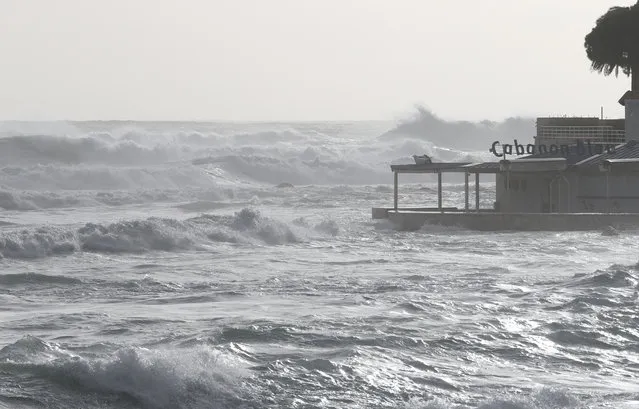 A picture shows strong waves hitting a beach restaurant after the storm Fabien on December 22, 2019, in Ajaccio, on the French Mediterranean island of Corsica. The storm Fabien which swept across southwest France and Corsica left over 30,000 houses without electricity in the afternoon of December 22, and caused the interruption of transport between the Mediterranean island and the mainland due to a swell and still threatening strong winds. (Photo by Pascal Pochard-Casabianca/AFP Photo)
