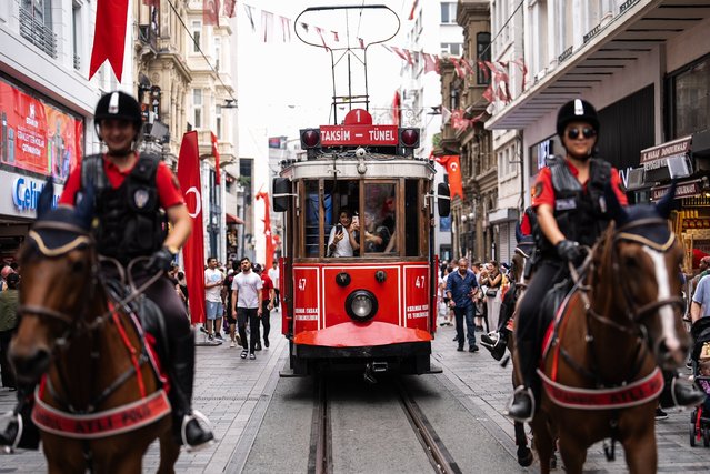 Mounted police patrol in Istiklal Street in Istanbul, Turkiye on September 09, 2024. Mounted police officers from the Istanbul Police Department, stationed at various locations throughout the city, particularly at tourist spots, have become popular with both locals and foreign visitors. The Mounted Police Group Directorate, a branch of the Riot Police Department, is responsible for a range of activities including preventive services, social events, official ceremonies, inspections of forests and promenades, as well as monitoring coastal areas, parks, and tourist destinations. (Photo by Hakan Akgun/Anadolu via Getty Images)