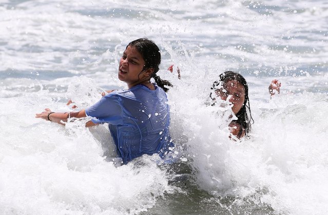 On July 28, 2024  foreign tourists at Haeundae Beach in Busan were taking a break from the heat while enjoying the waves. (Photo by Kim Dong-hwan)