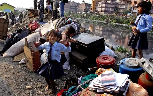 A young girl cries after her home on the banks of the Bagmati River was demolished by government forces in Katmandu, Nepal on May 8, 2012