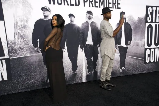 NBA player Dwyane Wade takes a photo of his wife actress Gabrielle Union at the premiere of “Straight Outta Compton” in Los Angeles, California August 10, 2015. The movie opens in the U.S. on August 14. (Photo by Mario Anzuoni/Reuters)