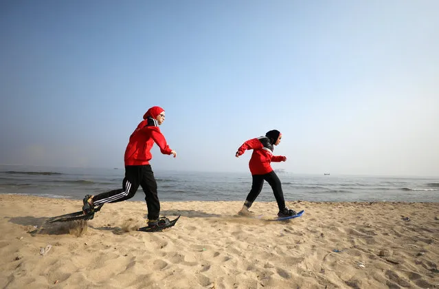 Special olympics athletes Esraa Gamal and Alaa Abdelaziz train with snowshoes on a beach in Alexandria, Egypt, July 18, 2017. (Photo by Mohamed Abd El Ghany/Reuters)