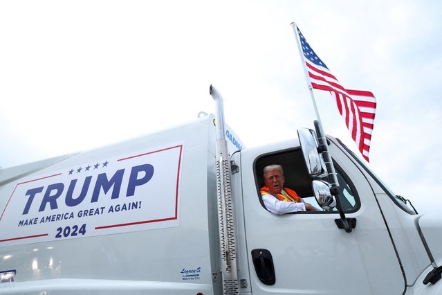 Republican presidential nominee and former U.S. President Donald Trump sits inside garbage truck, in Green Bay, Wisconsin on October 30, 2024. (Photo by Brendan McDermid/Reuters)