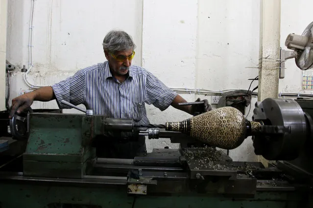 A man works at the Taha hookah factory in Baghdad, Iraq July 2, 2016. (Photo by Khalid al Mousily/Reuters)