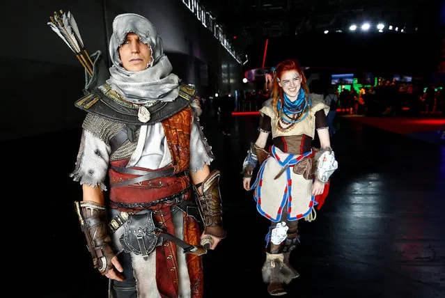 People dressed up as video game characters at the world's largest computer games fair, Gamescom, in Cologne, Germany August 23, 2017. (Photo by Wolfgang Rattay/Reuters)