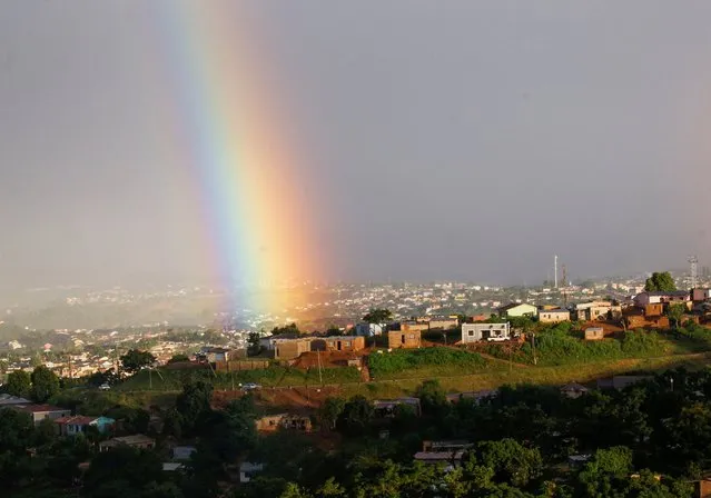 A rainbow is seen briefly after flooding in Inanda, Durban, South Africa, April 13, 2022. (Photo by Rogan Ward/Reuters)