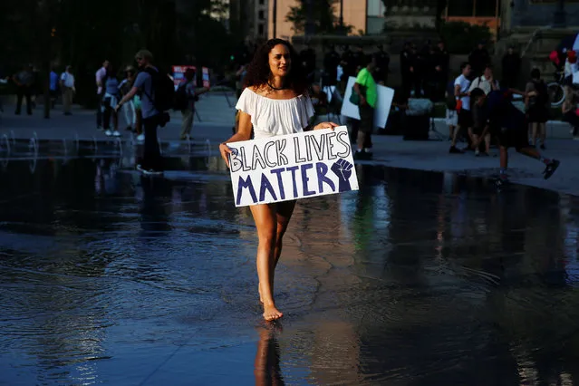 Nyima Coleman holds a Black Lives Matter sign at Public Square outside the Republican National Convention in Cleveland, Ohio, U.S. July 19, 2016. (Photo by Shannon Stapleton/Reuters)