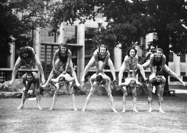 Women divers who are competing in the European Championships at Wembley, London playing leapfrog with the speedway riders as part of a “keep fit” regime. 6th July 1938. (Photo by George W. Hales)