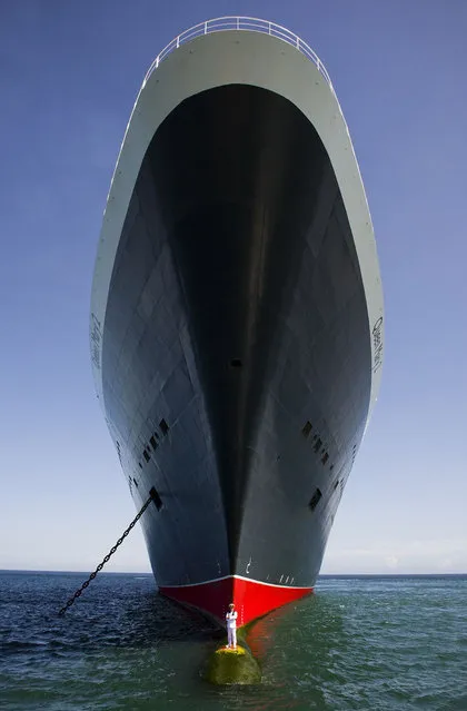 Queen Mary 2's Captain Perches On The Bow Of His Vast Ship