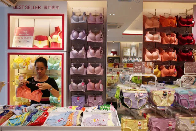A sales representative works at Cosmo Lady lingerie store in the southern Chinese city of Shenzhen,  China July 15, 2016. (Photo by Bobby Yip/Reuters)