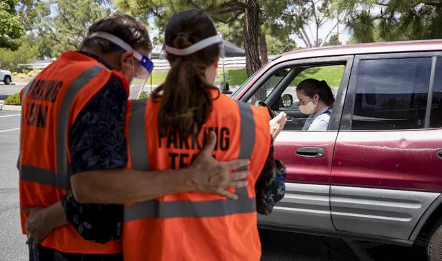 Driver Sofia Scanlon prays at a drive-thru prayer on National Day of Prayer at Rolling Hills Covenant Church during the global outbreak of the coronavirus disease (COVID-19), in Lomita, California, U.S., May 7, 2020. (Photo by Mario Anzuoni/Reuters)