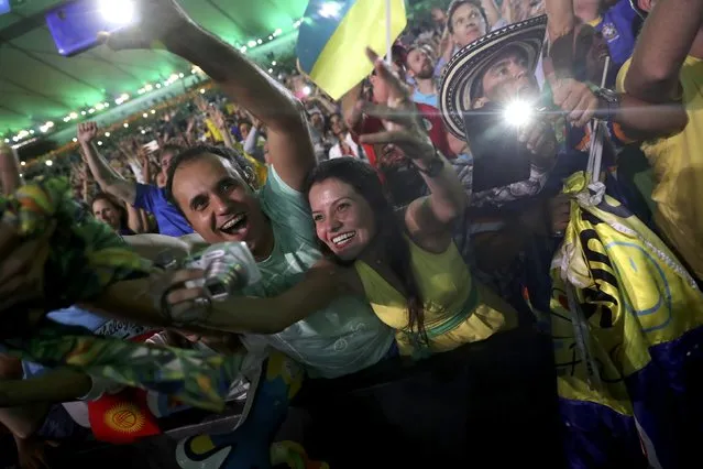 2016 Rio Olympics, Opening ceremony, Maracana, Rio de Janeiro, Brazil on August 5, 2016. Fans from Brazil celebrate in the stands during the opening ceremony. (Photo by Damir Sagolj/Reuters)