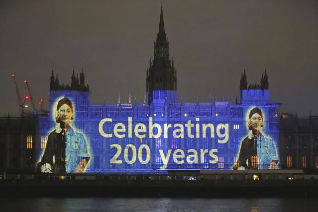 An image of Florence Nightingale is projected on the Houses of Parliament in Westminster, London, on International Nurses Day and to mark the 200th anniversary of the birth of the nurse, Tuesday, May 12, 2020. Historians have praised Florence Nightingale on the 200th anniversary of her birth, and said her legacy has “never been more relevant” amid the coronavirus pandemic. Staff at the Florence Nightingale Museum in Westminster said her key nursing values – which focused on maintaining good hygiene, regularly washing hands and carrying out evidence-based practices – have been widely echoed over the past months. (Photo by Jonathan Brady/PA Wire via AP Photo)