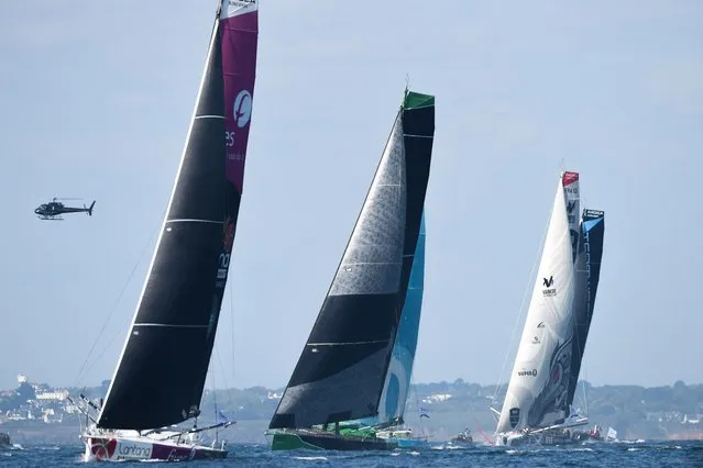 (From L) French skipper Louis Duc sails on his Imoca 60 monohull “Fives Lantana Environnement”, British skipper Conrad Colman on his Imoca 60 monohull “Imagine” and French skipper Maxime Sorel on his Imoca 60 monohull “V and B Monbana – Mayenne” as they take the start of the 48-hour Azimut Trophy race, including a loop in the Atlantic Ocean, the last confrontation before the Route du Rhum – Destination Guadeloupe solo race, off the coast of Lorient, western France, on September 15, 2022. (Photo by Jean-Francois Monier/AFP Photo)