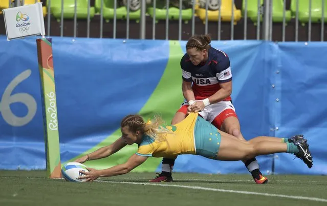 2016 Rio Olympics, Rugby, Preliminary, Women's Pool A Australia vs USA, Deodoro Stadium, Rio de Janeiro, Brazil on August 7, 2016. Emma Tonegato (AUS) of Australia scores as she is tackled by Leyla Alev Kelter (USA) of USA. (Photo by Phil Noble/Reuters)