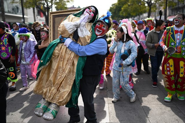 Clowns take part in the annual pilgrimage to the Guadalupe Basilica to ask for work and health, in Mexico City on December 21, 2023. (Photo by Alfredo Estrella/AFP Photo)