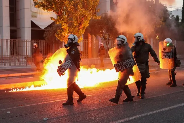 Riot police walk past flames as they clash with protesters, during a demonstration against the death in Minneapolis police custody of George Floyd, outside the U.S. embassy in Athens, Greece, June 3, 2020. (Photo by Alkis Konstantinidis/Reuters)