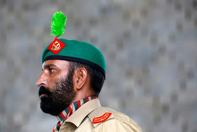 An army soldier stands during a flag hosting ceremony to celebrate the country's 70th Independence Day at the mausoleum of Muhammad Ali Jinnah in Karachi, Pakistan, August 14, 2016. (Photo by Akhtar Soomro/Reuters)