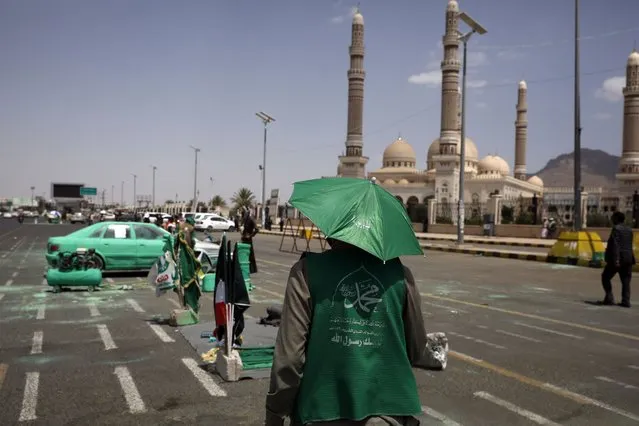Yemenis have vehicles colored in green in preparation for celebrations of the birthday of the prophet Muhammad a day after a UN-brokered truce expired, in Sana'a, Yemen, 03 October 2022. The Houthis have announced the end of a UN-brokered nationwide truce after the warring parties in Yemen failed to reach an agreement to extend the truce that expired 02 October. UN envoy for Yemen Hans Grundberg called on the Houthis and the Saudi-backed Yemeni government to refrain from acts of provocation as the consultations continue. The truce has been holding since April 2022 and was renewed on 02 August for an additional two months through 02 October. (Photo by Yahya Arhab/EPA/EFE)
