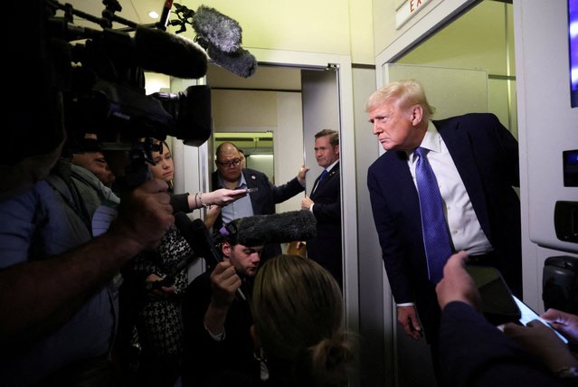U.S. President Donald Trump speaks to reporters aboard Air Force One on his return to Washington on March 17, 2025. (Photo by Kevin Lamarque/Reuters)