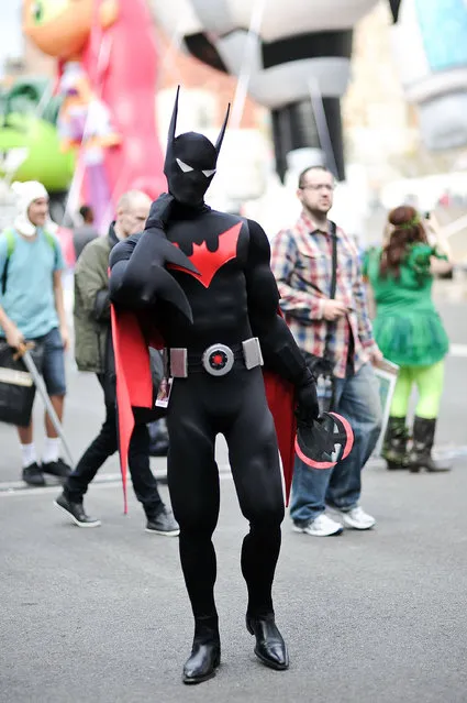 A Comic Con attendee poses as Batman during the 2014 New York Comic Con at Jacob Javitz Center on October 9, 2014 in New York City. (Photo by Daniel Zuchnik/Getty Images)
