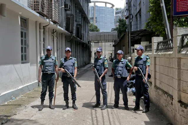 In this Wednesday, July 27, 2016, file photo, Bangladeshi policemen stand guard outside a morgue at the Dhaka Medical College Hospital during the autopsy on the bodies of suspected Islamic militants who were killed in Dhaka, Bangladesh. Police in Bangladesh, on Saturday, say they have killed three suspected militants, including one of two alleged masterminds of a major attack on a cafe last month that left 20 people dead. Top counterterrorism official Monirul Islam said police raided a two-story house in Narayanganj district near Dhaka and killed the suspects early Saturday. (Photo by AP Photo)