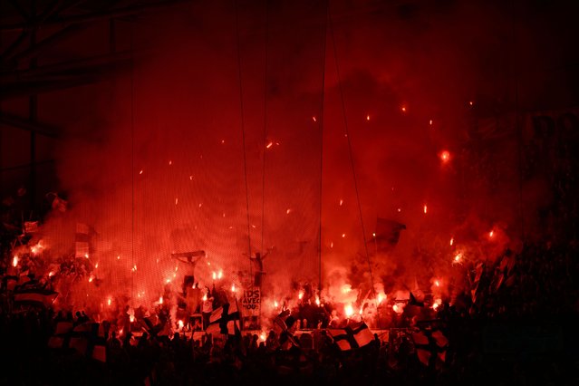 Marseille's fans celebrate their victory 3-2 at the end of their ligue 1 football match Olympique de Marseille (OM) vs Toulouse FC at the Velodrome stadium in Marseille on 06 April, 2025. (Photo by Christophe Simon/AFP Photo)
