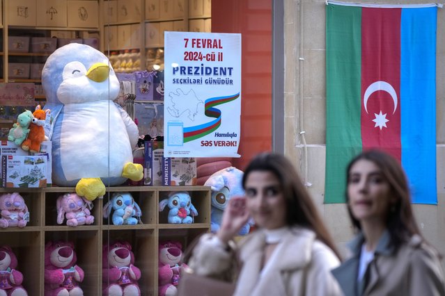 Flag of Azerbaijan is displayed in shop windows in Baku, Azerbaijan, Monday, February 5, 2024. Azerbaijan will hold presidential elections on Wednesday, Feb. 7, 2024. (Photo by Sergei Grits/AP Photo)