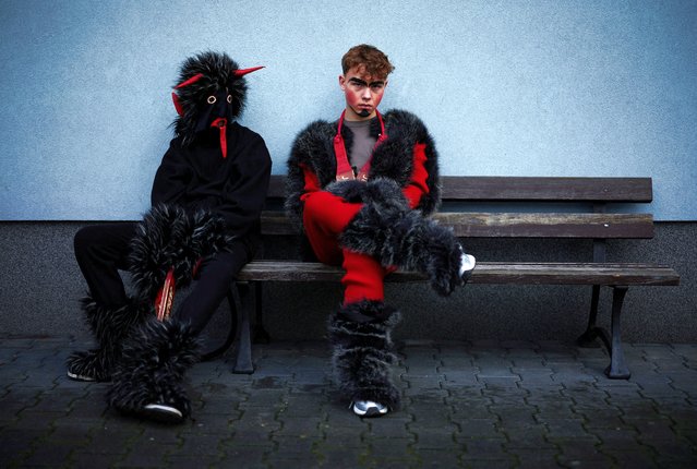 Revellers take part in a traditional event marking the last day of the carnival season called “Kusaki”, a folk party and a re-enactment showing the “defeat of Death” where all roles are played by males, which takes place on Shrove Tuesday in Jedlinsk, Poland, on February 13, 2024. (Photo by Kacper Pempel/Reuters)