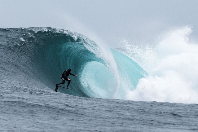 South African big wave surfer Jaques Theron rides a wave at Dungeons offshore reef on a foil board as seasonal cold fronts drive big swells into the Cape Peninsula in Cape Town, South Africa on June 1, 2025. (Photo by Nic Bothma/Reuters)