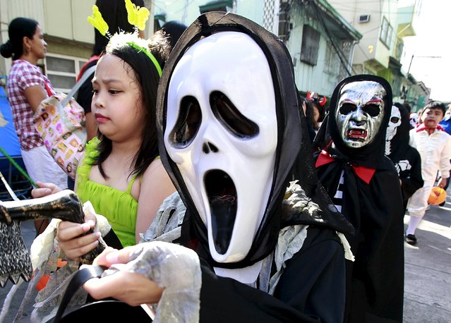 Students of Brainshire Science School wear costumes as they participate in a halloween parade in Paranaque city, metro Manila October 30, 2015. (Photo by Romeo Ranoco/Reuters)