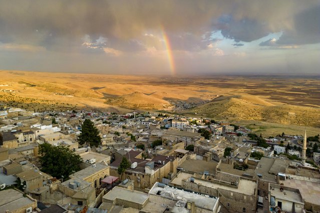 This aerial general view shows the old Midyat town in Mardin province, southeastern Turkey, on July 1, 2024. Archaeologists stumbled upon the city-under-a-city “almost by chance” after an excavation of house cellars in the city of Midyat led to the discovery of a vast cave system in 2020. (Photo by Yasin Akgul/AFP Photo)