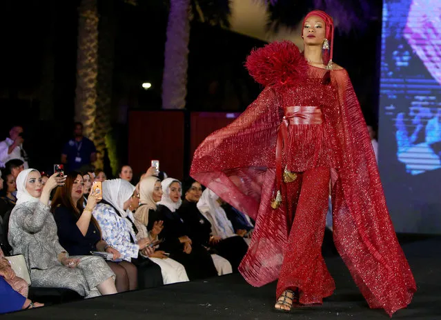 A model wears a creation designed by Indian designer Pria Kataria Puri, during the Kuwait international fashion week in Kuwait City on March 22, 2018. (Photo by Yasser Al-Zayyat/AFP Photo)